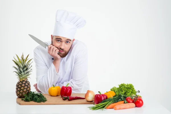 Portret van een jonge chef-kok bereiden van voedsel — Stockfoto