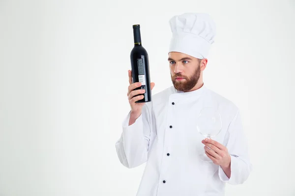 Chef cuisinier tenant bouteille avec du vin — Photo
