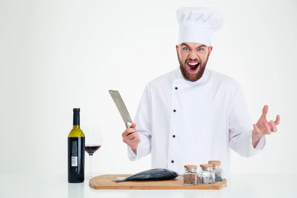 Портрет веселого повара-мужчины, готовящего рыбу — стоковое фото