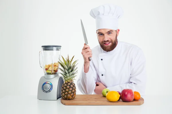 Male chef reading to cutting vegetables — Stock Photo, Image