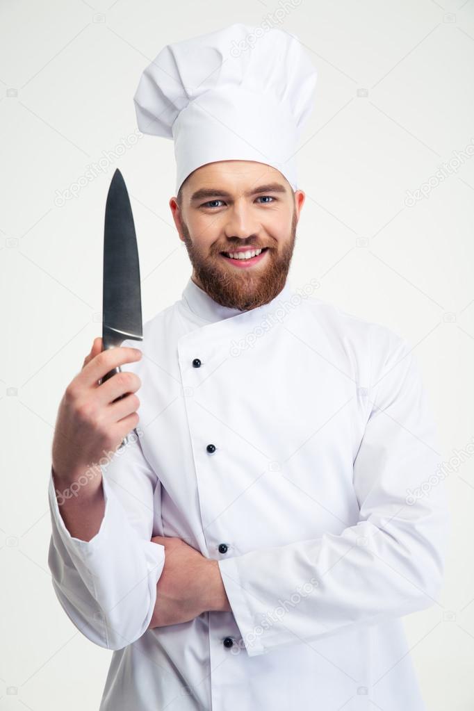 Portrait of a smiling male chef cook showing knife