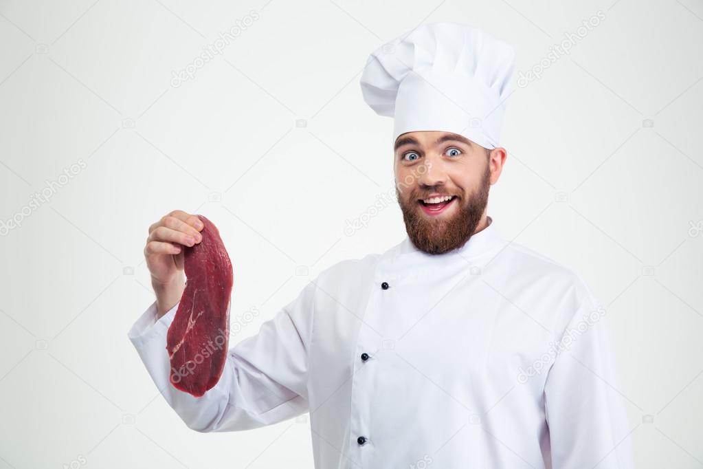 Happy male chef cook holding meat