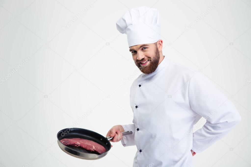 Chef cook holding fresh meat on pan