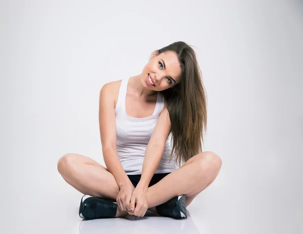 Menina feliz sentado no chão — Fotografia de Stock