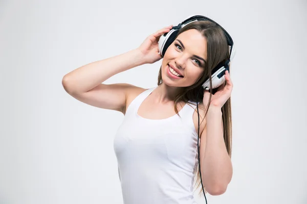 Pretty girl listening the music in headphones — Stock Photo, Image