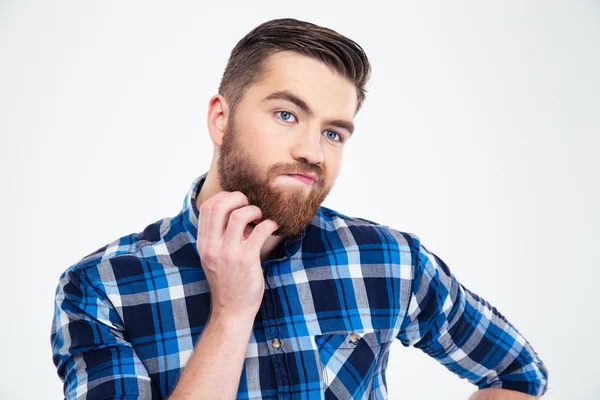 Hombre pensativo tocándose la barba con la mano —  Fotos de Stock