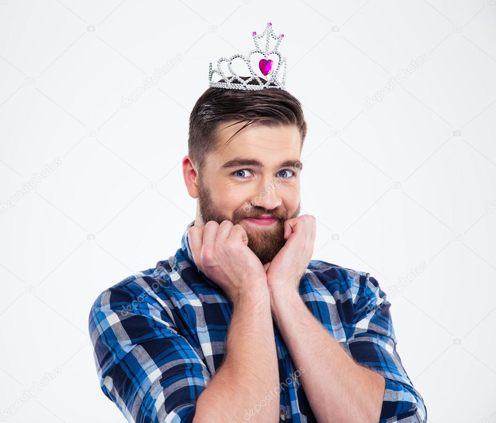 Portrait of a happy feminine man in queen crown