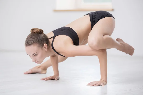 Woman doing yoga exercises in gym — Stock Photo, Image