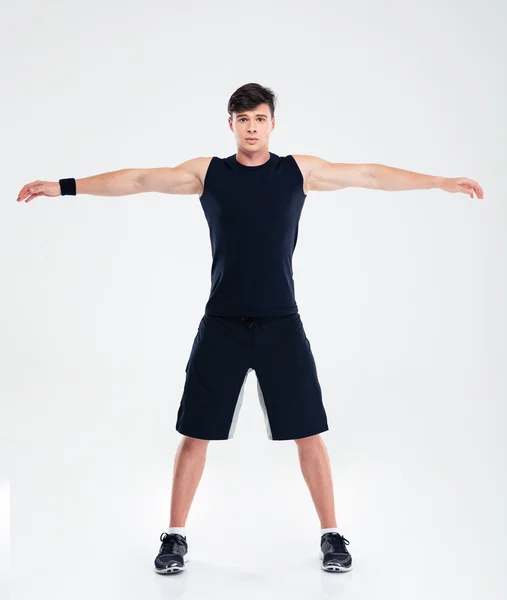 Homem de fitness fazendo exercícios de aquecimento — Fotografia de Stock