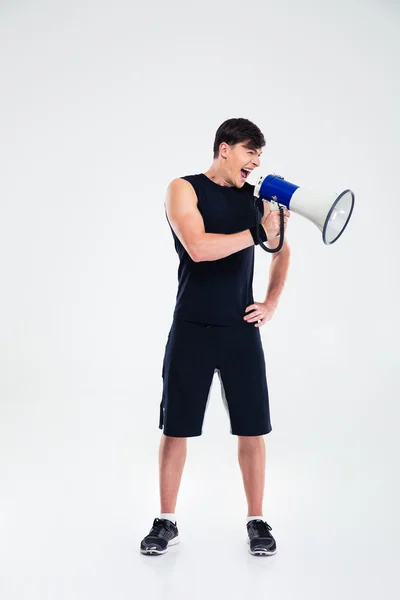 Fitness man shouting in loudspeaker — Stock Photo, Image