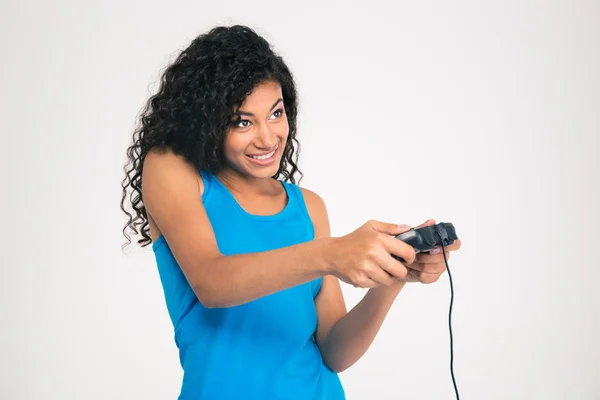 Feliz mujer afro jugar video juego con joystick —  Fotos de Stock