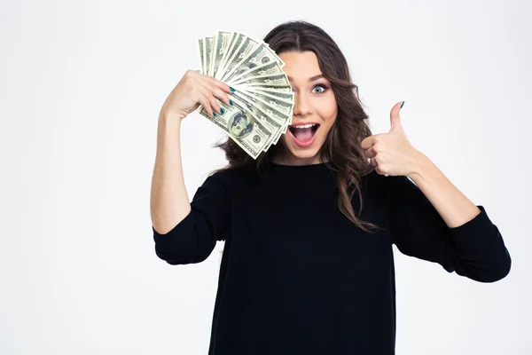 Chica cubriendo su ojo con billetes de dólar — Foto de Stock