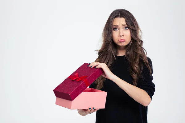Sad woman standing with opened gift box — Stock Photo, Image
