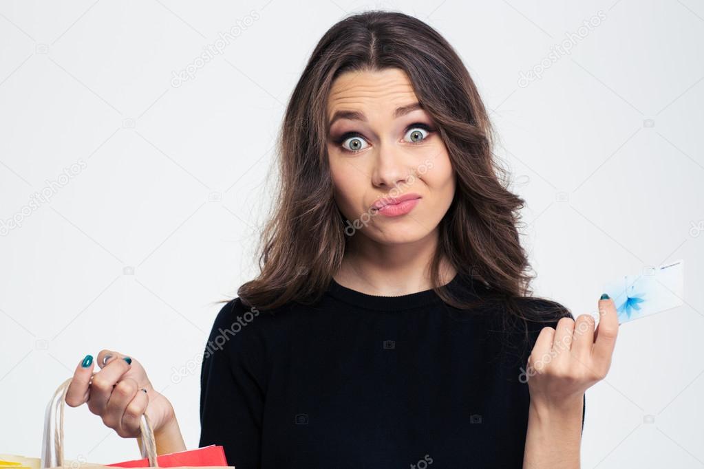 Woman holding shopping bags and bank card