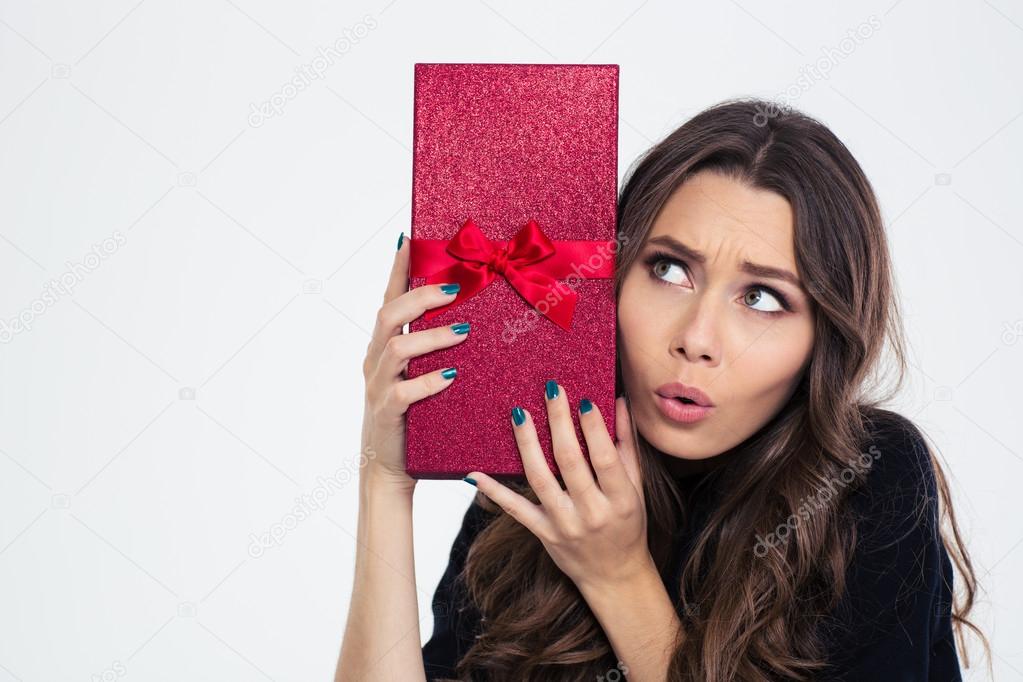 Portrait of a beautiful woman holding gift box