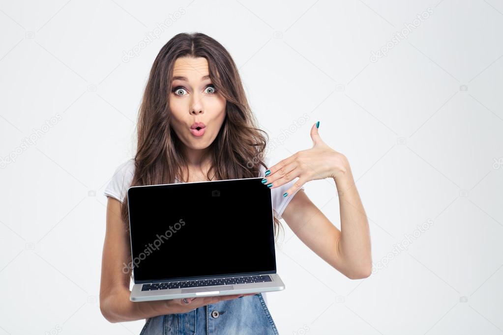 Woman pointing finger on blank laptop computer screen