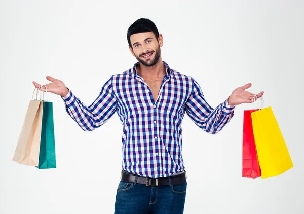 Portrait of a happy man holding shopping bags — Stock Photo, Image