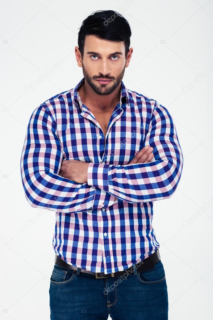 Handsome man standing with arms folded