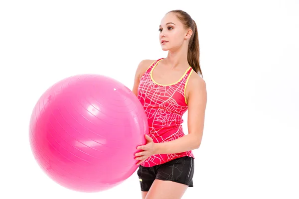Mujer deportiva sosteniendo pelota de fitness —  Fotos de Stock