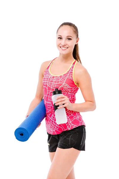 Mulher de esportes segurando shaker e tapete de ioga — Fotografia de Stock