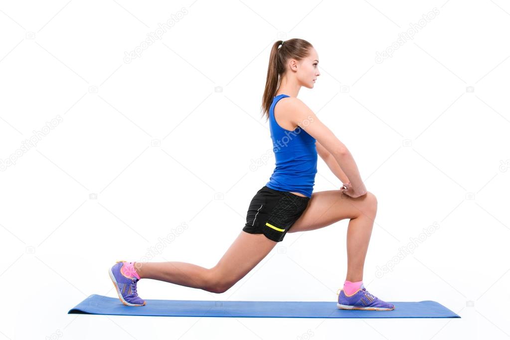 Sports woman doing warm up exercises