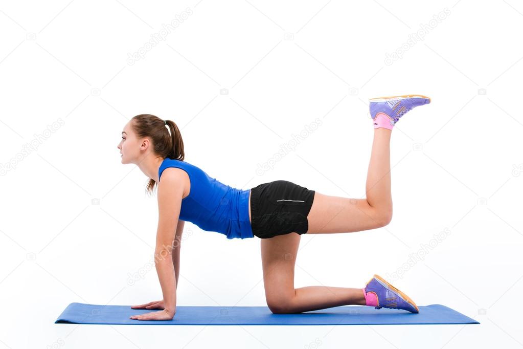 Young sportswoman in sportwear doing aerobic