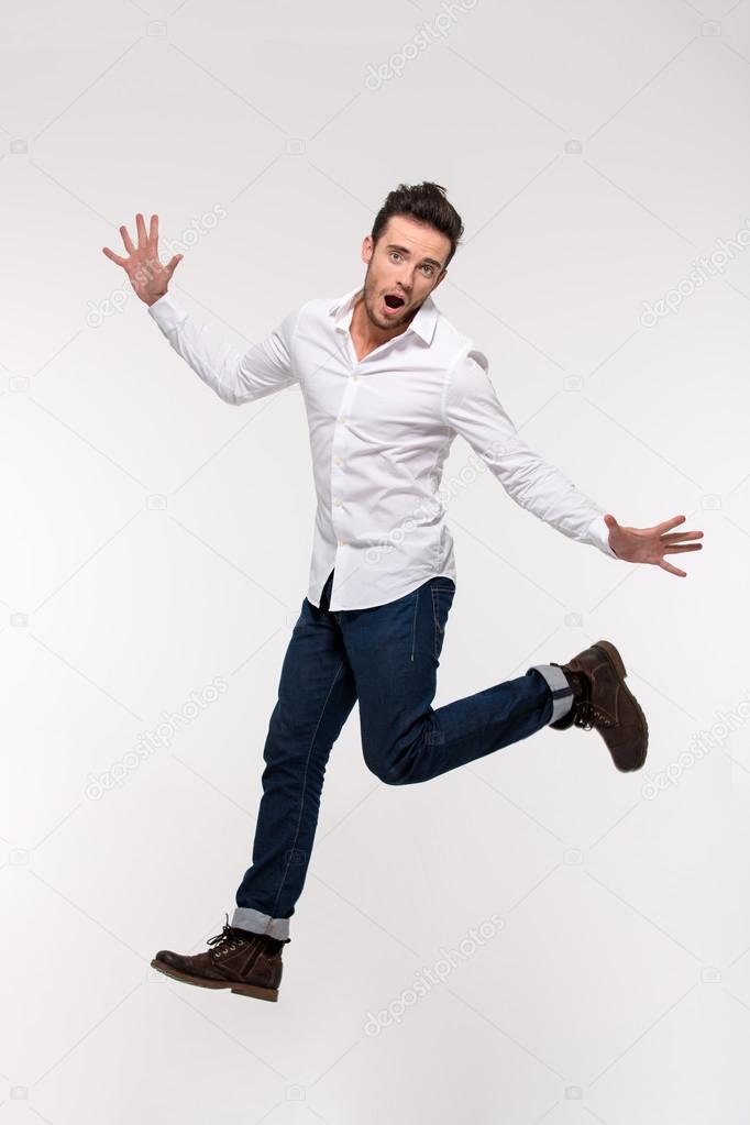 Portrait of a funny casual man jumping
