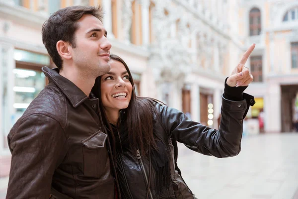 Woman pointing finger on something to her boyfriend — Stock Photo, Image