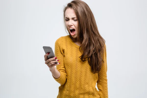 Woman shouting on smartphone — Stock Photo, Image