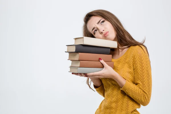 Retrato de uma mulher cansada segurando livros — Fotografia de Stock