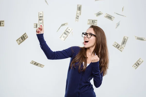 Mujer alegre de pie bajo lluvia de dinero —  Fotos de Stock