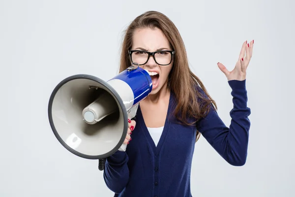 Portrait of angry woman screaming in megaphone — Stock Photo, Image