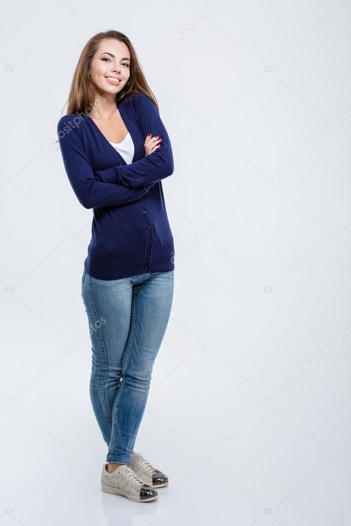 Happy woman standing with arms folded