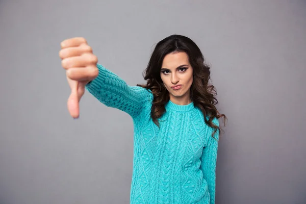 Young woman showing thumb down — Stock Photo, Image
