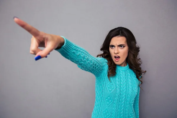 Woman pointing finger on something — Stock Photo, Image
