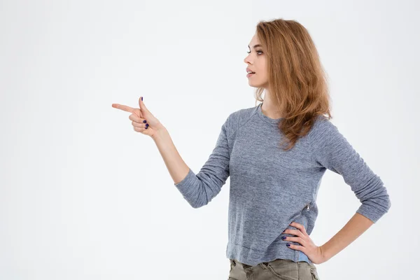 Woman pointing finger away — Stock Photo, Image