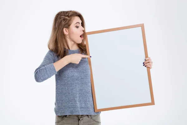 Woman pointing finger on blank board — Stock Photo, Image
