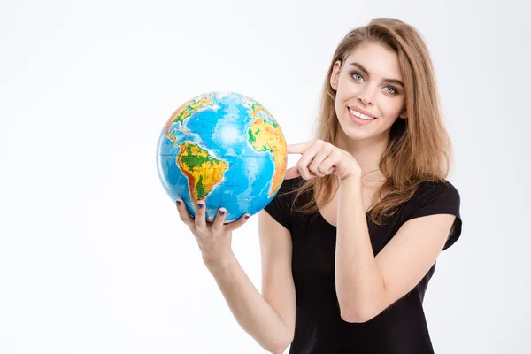 Vrouw wijzende vinger op wereldbol — Stockfoto