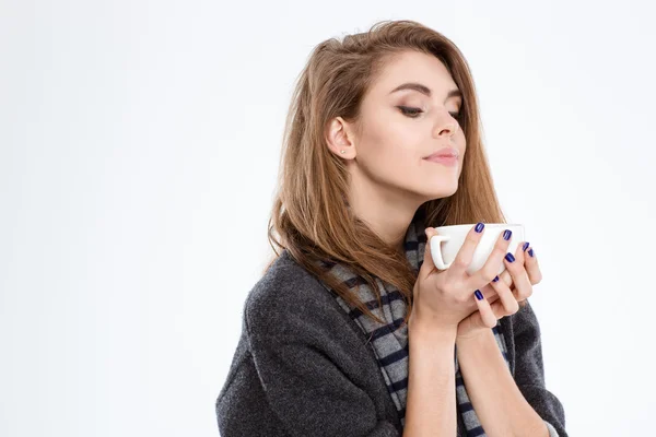 Cute woman smelling cup with coffee — Stock Photo, Image