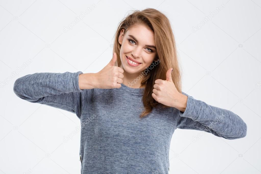 Smiling woman showing thumbs up