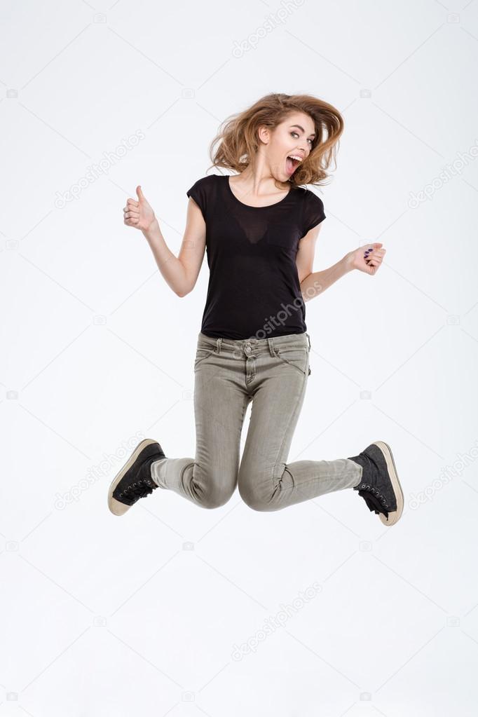 Portrait of a cheerful woman jumping