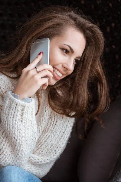 Positive female talking on cell phone and smile — Stock Photo, Image