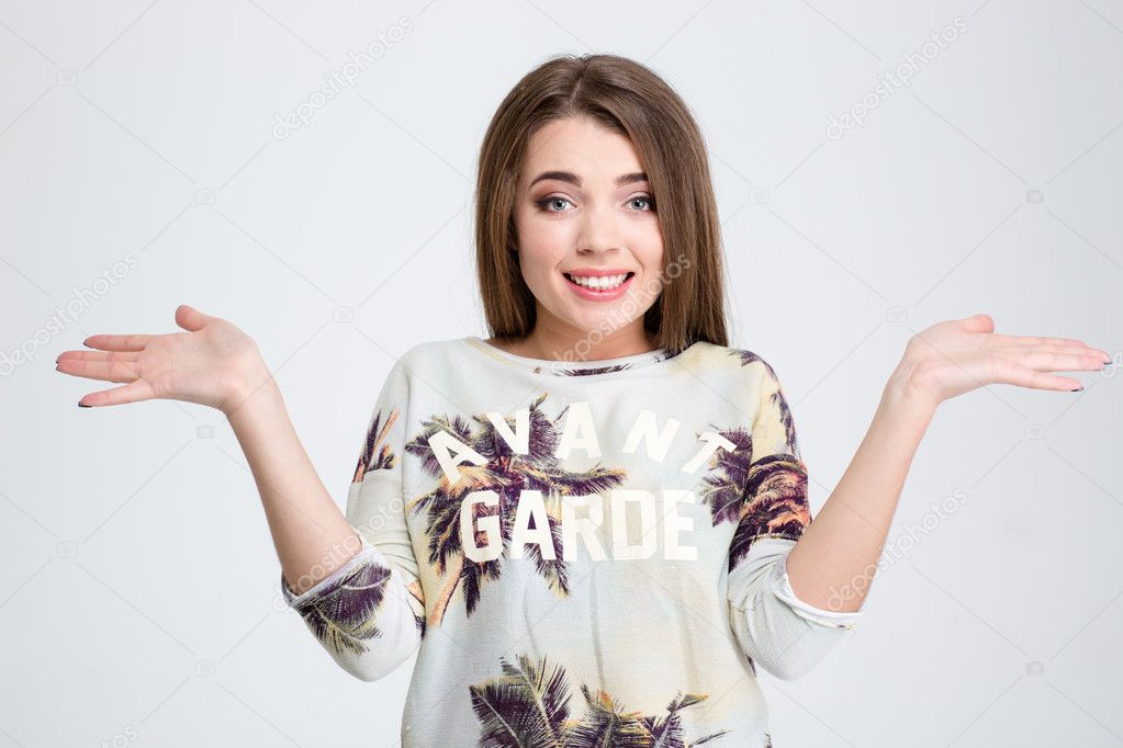 Young woman shrugging shoulders