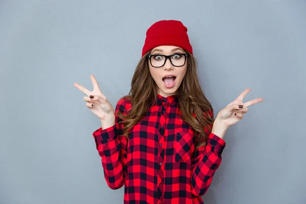 Cheerful woman showing two fingers sign — Stock Photo, Image