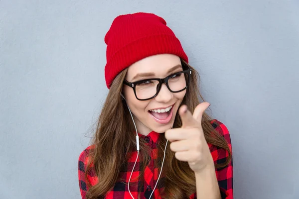 Cheerful woman pointing finger at camera — Stock Photo, Image