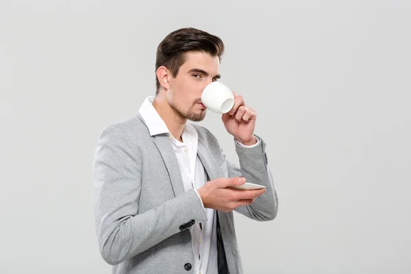 Attractive businessman drinking corree — Stock Photo, Image