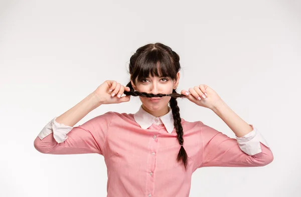 Mulher engraçada fazendo bigode com pigtail — Fotografia de Stock