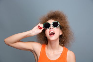 Portrait of beautiful joyful laughing curly model 