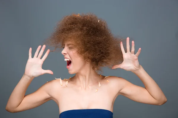 Hysterical excited curly woman sreaming and shaking her head — Stockfoto