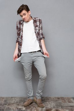 Casual man exhibiting his empty pockets